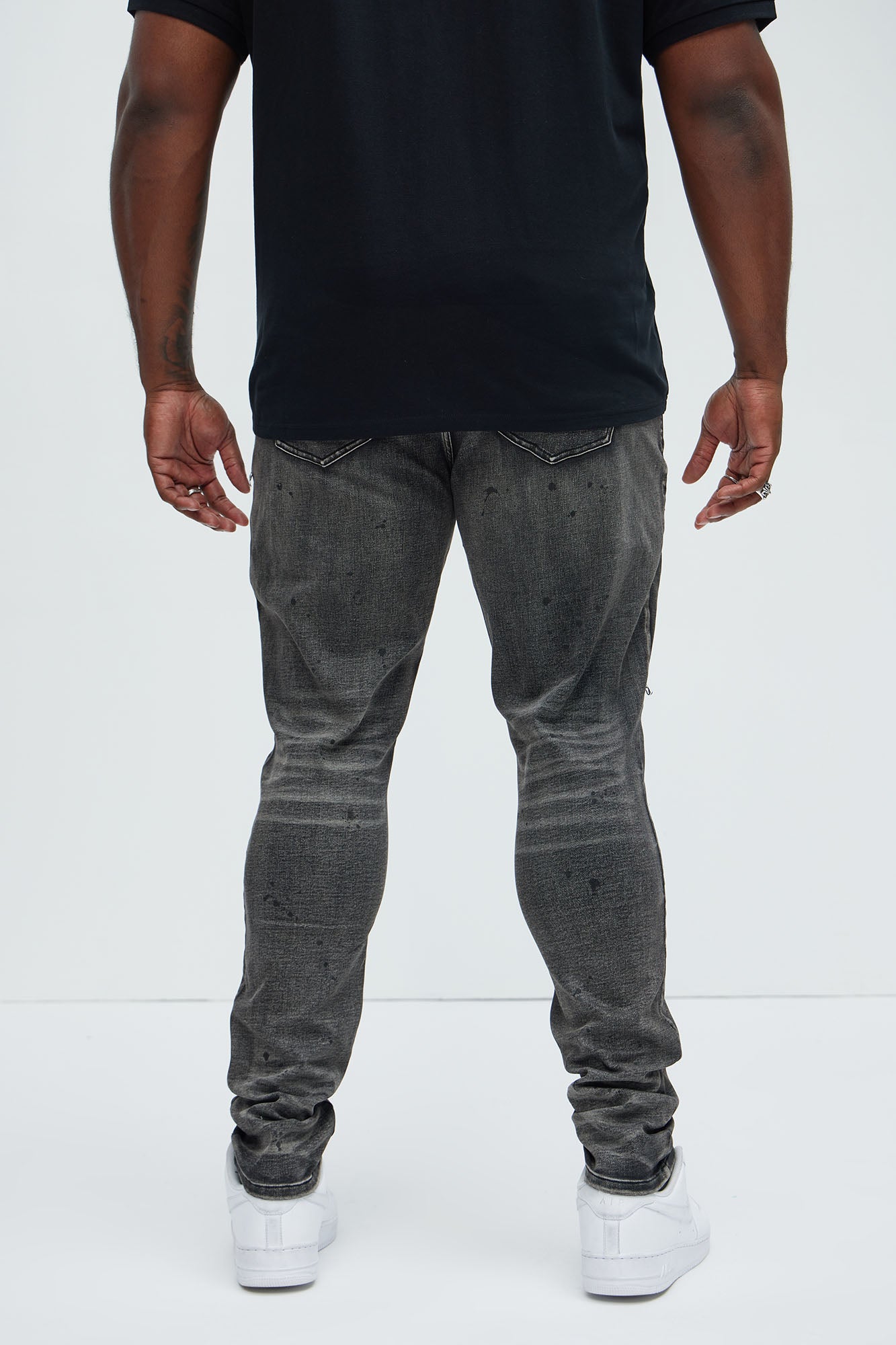 Put You On Spray Painted Stacked Skinny Jeans - Black Fashion Nova