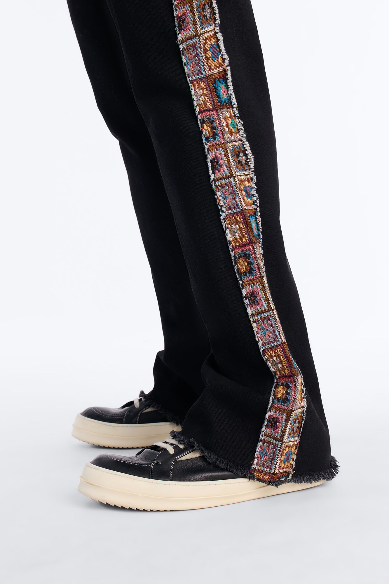 Stacked Slim Flare Split Tapestry Jeans - Black Fashion Nova