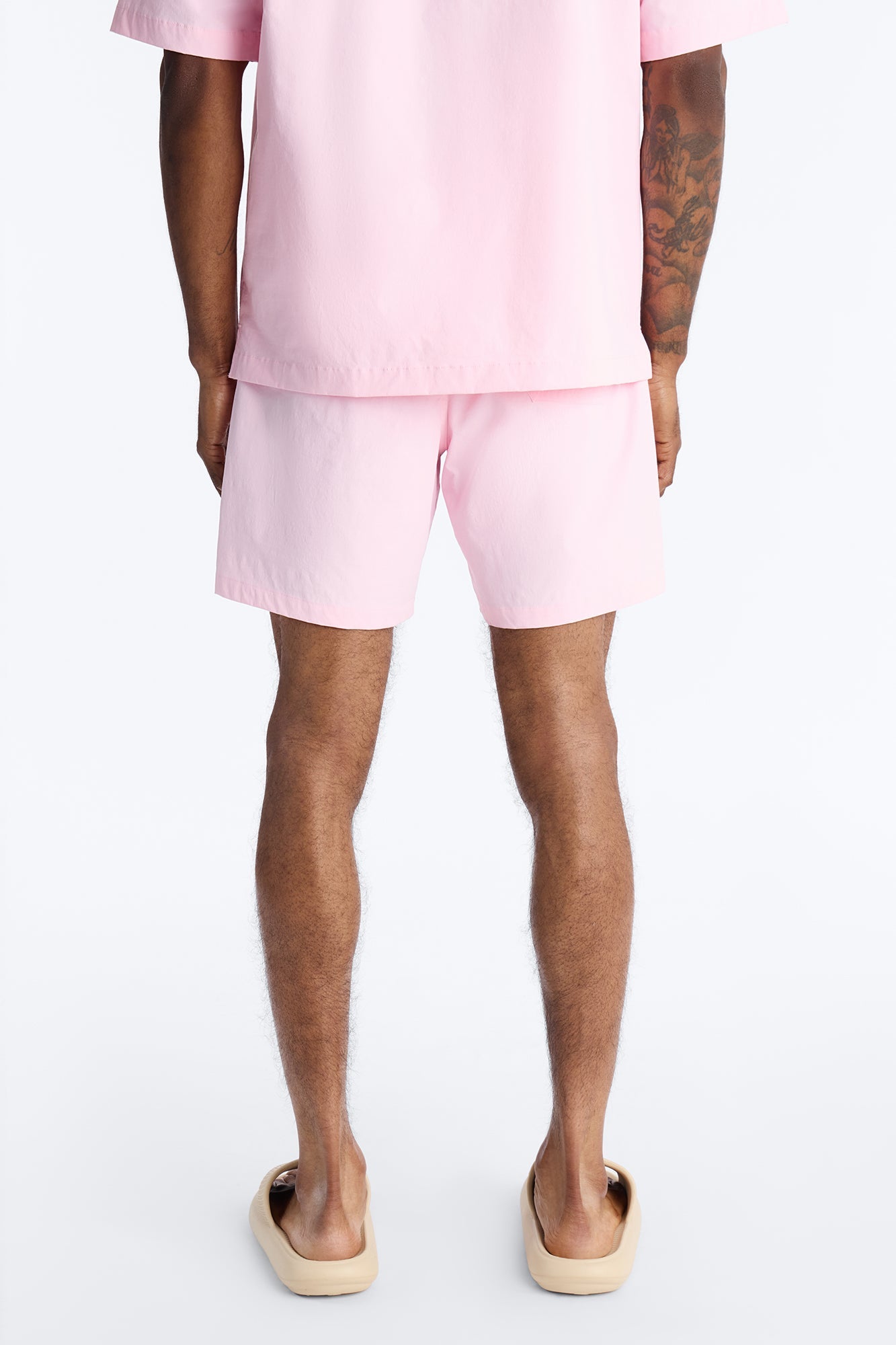 Montez Stretch Swim Trunk 7″ - Pink Fashion Nova