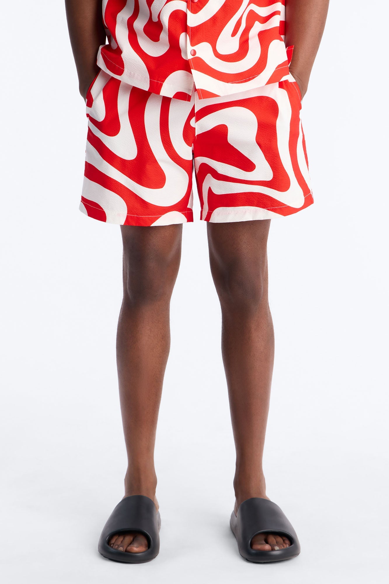 Groovy Abstract Printed Seersucker Swim Trunk 6″ - Red Fashion Nova