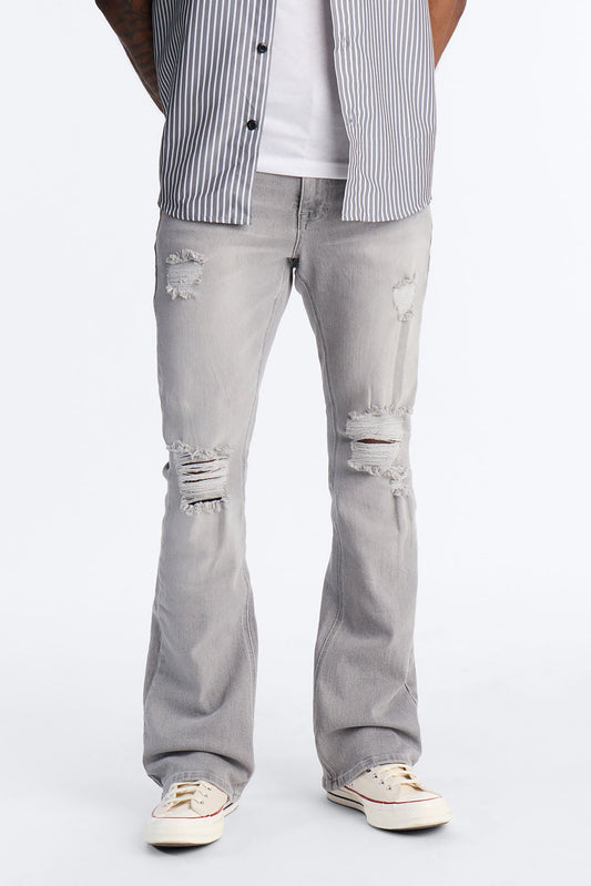 Essential Destroyed Stacked Slim Flare Stretch Jean - Grey Fashion Nova