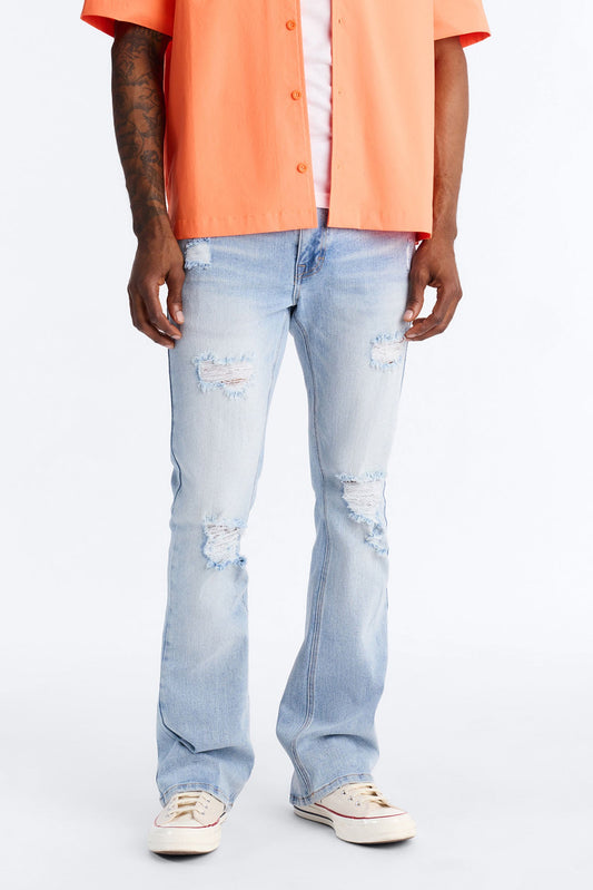 Essential Destroyed Stacked Skinny Flare Stretch Jean - Light Blue Wash Fashion Nova
