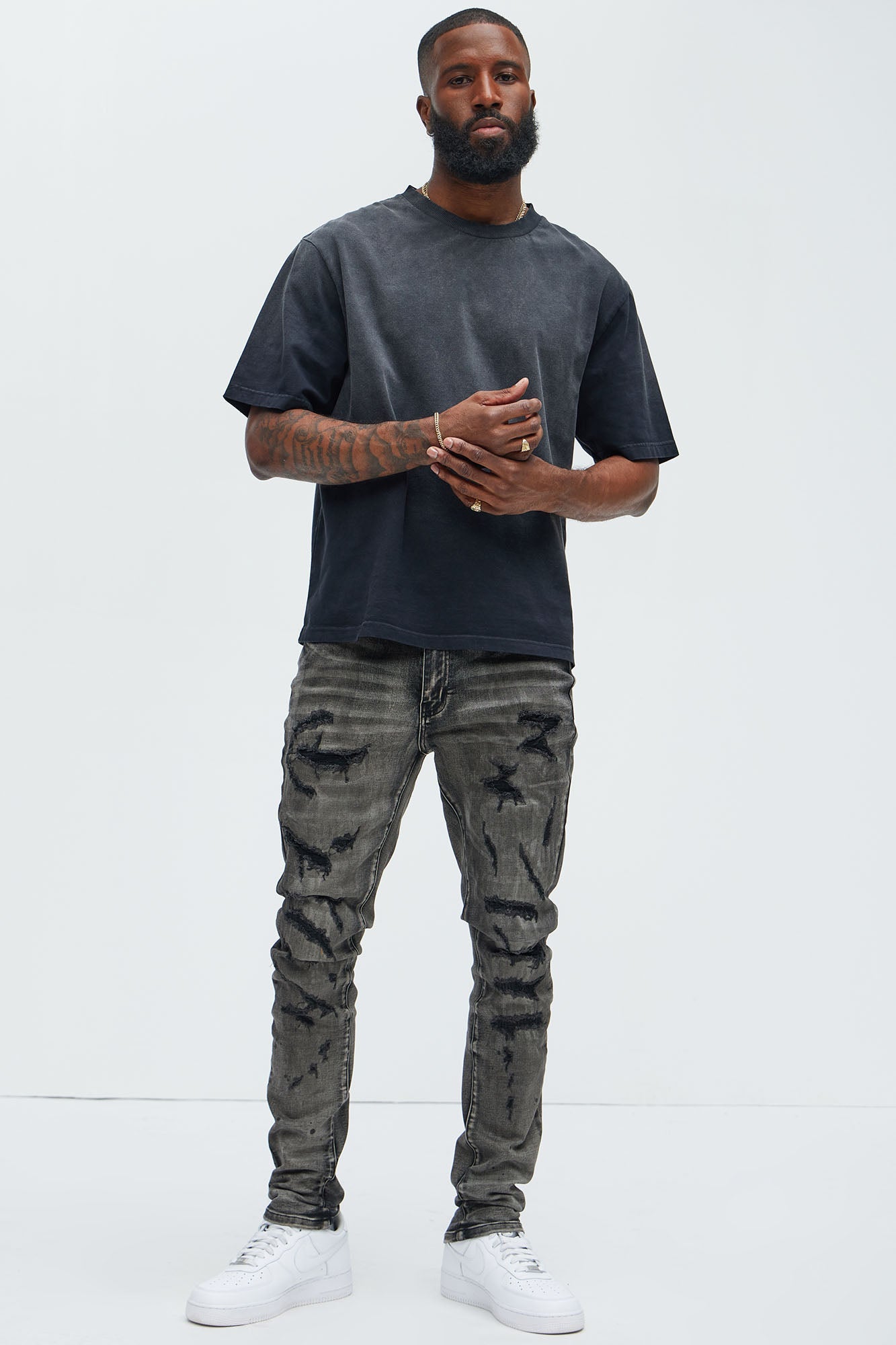 Put You On Spray Painted Stacked Skinny Jeans - Black Fashion Nova