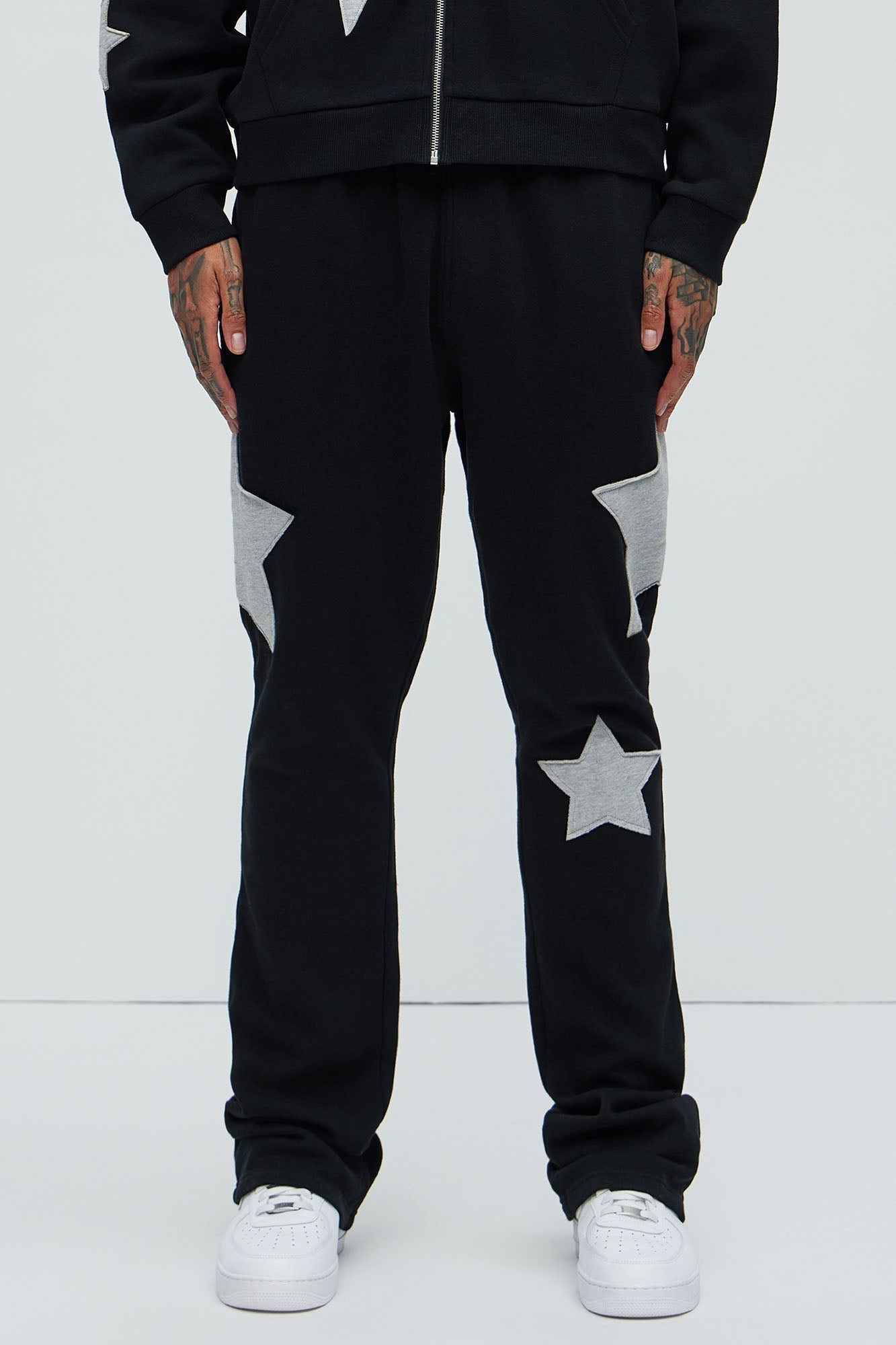 Tyson Stars Skinny Flared Sweatpants - Black Fashion Nova