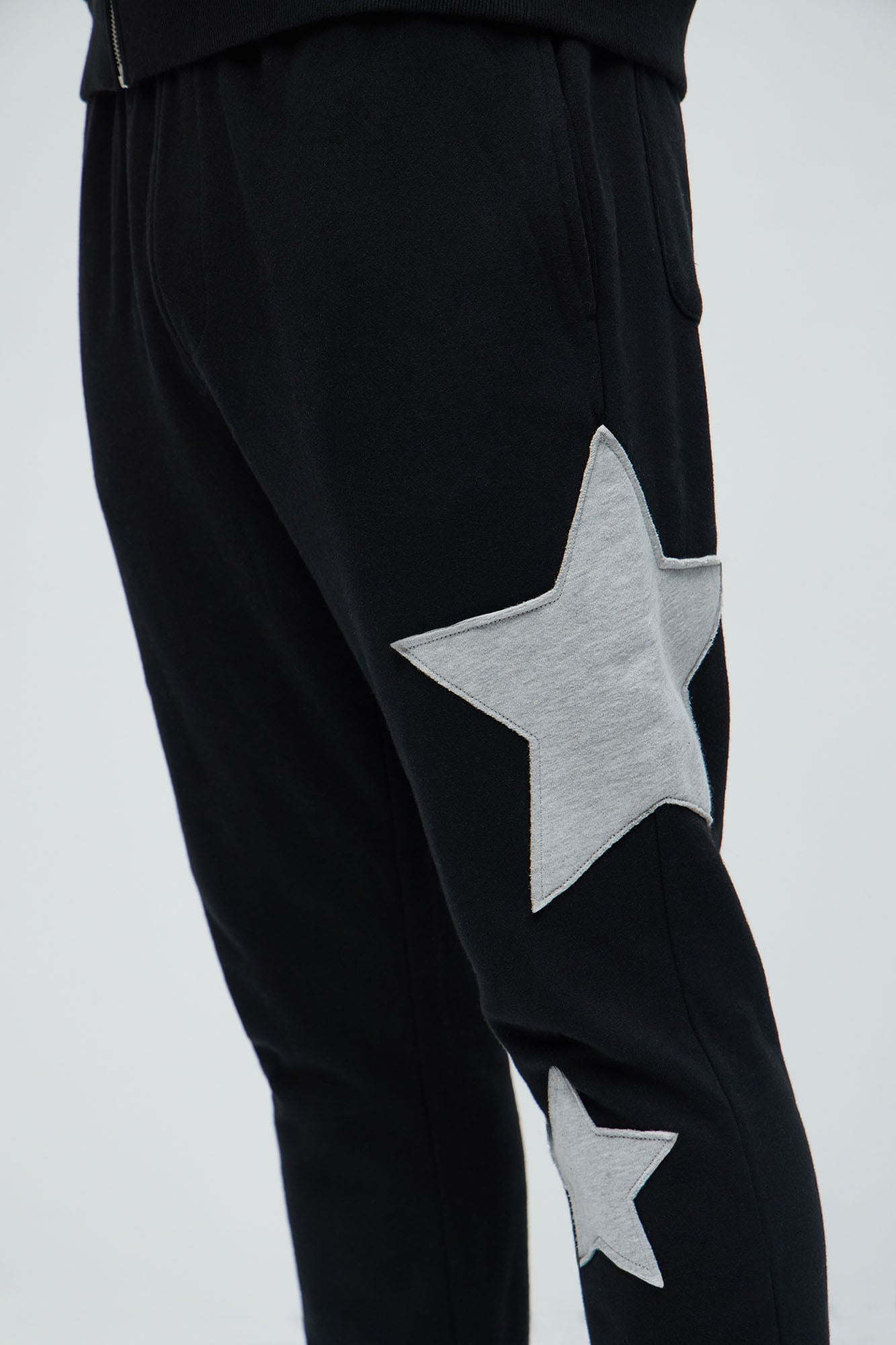 Tyson Stars Skinny Flared Sweatpants - Black Fashion Nova