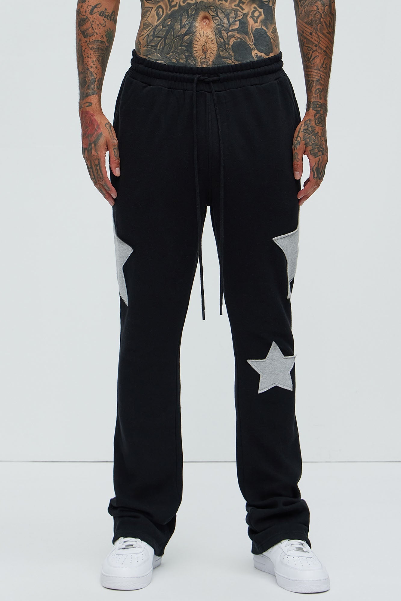 Tyson Stars Skinny Flared Sweatpants - Black Fashion Nova