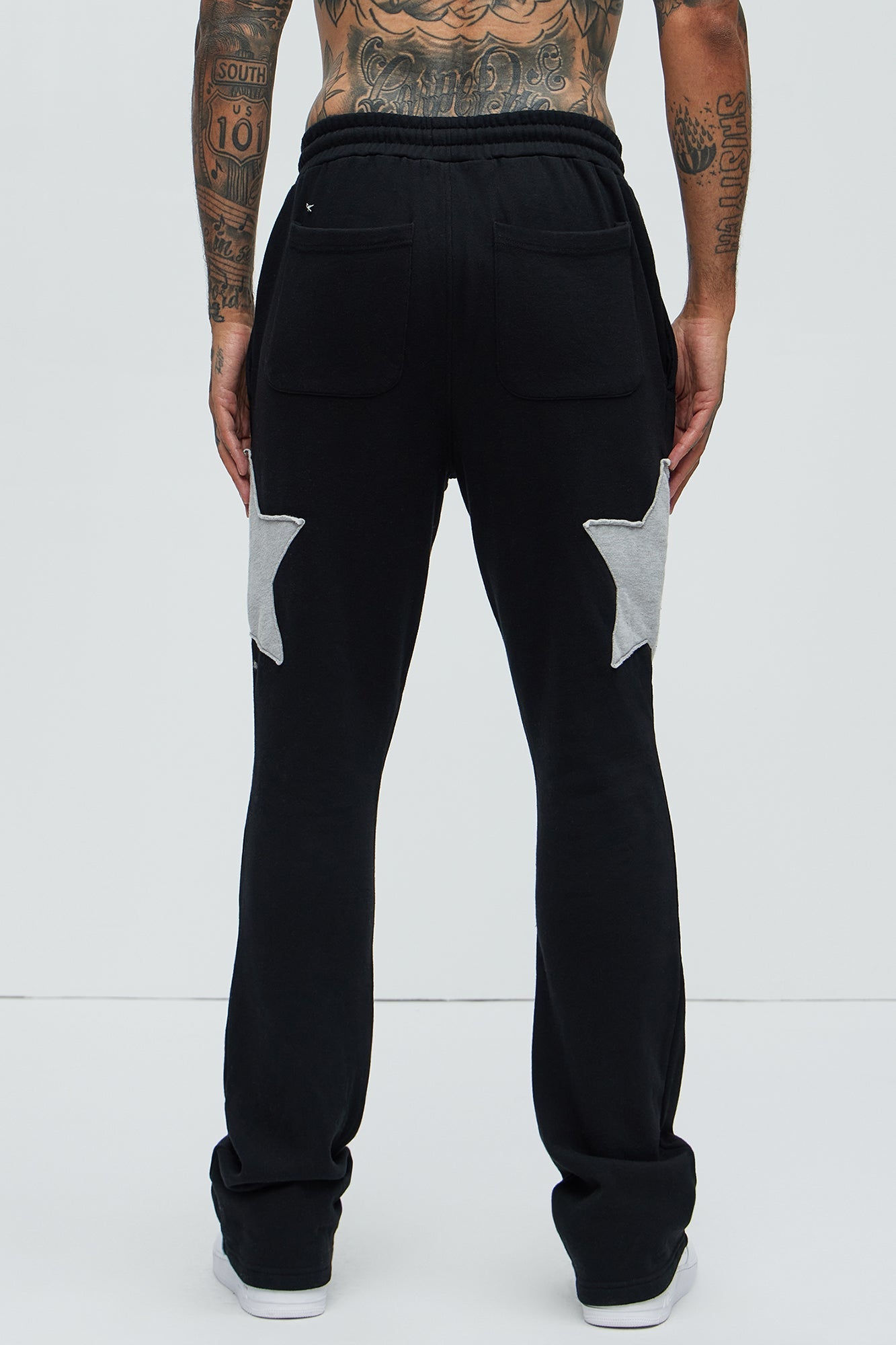 Tyson Stars Skinny Flared Sweatpants - Black Fashion Nova